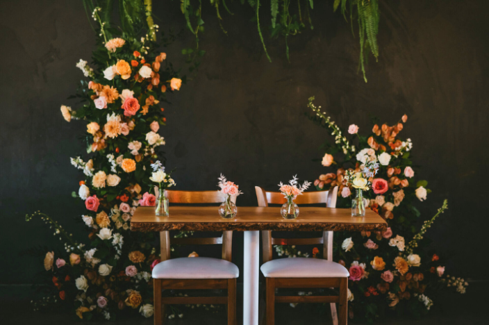 Elegant sweetheart table setup with romantic lighting at a FruitCraft wedding reception.