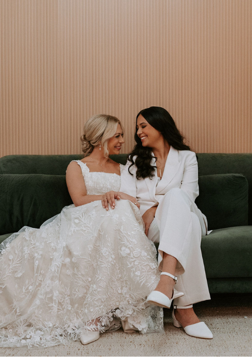 LGBTQ couple sharing a quiet moment in the private getting ready room at FruitCraft before their ceremony.