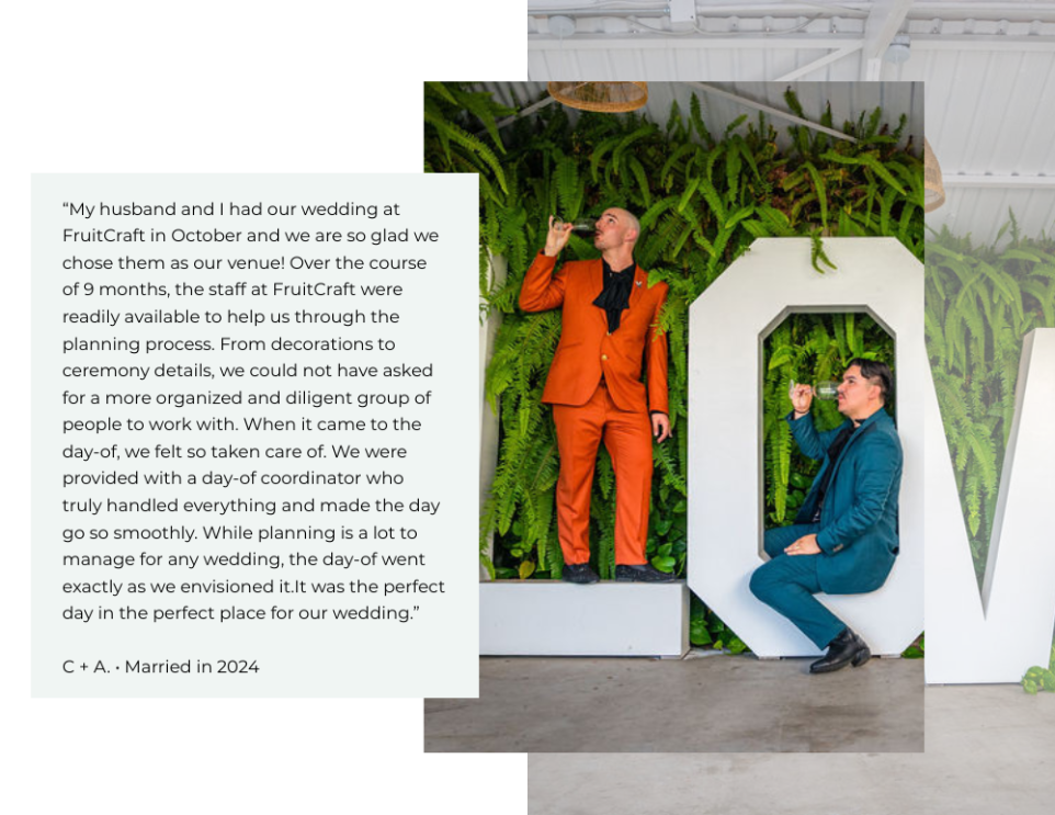 LGBTQ couple posing in front of the illuminated LOVE sign at FruitCraft’s modern San Diego venue.