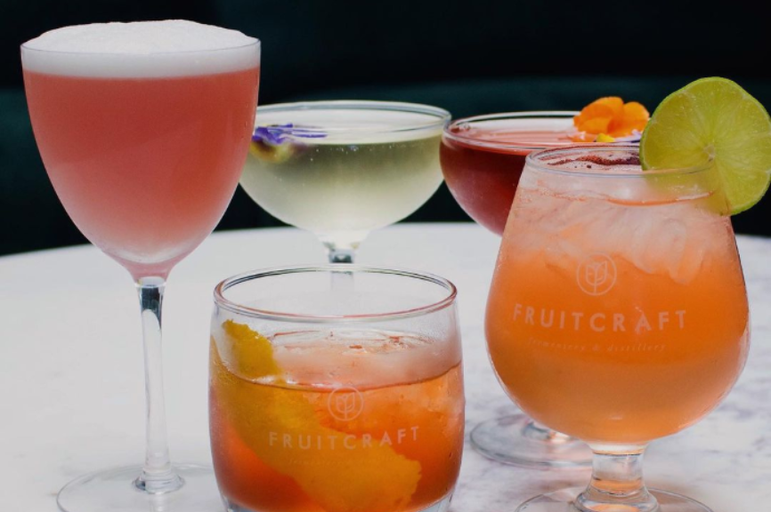 A colorful lineup of handcrafted cocktails made with FruitCraft’s house-distilled spirits.