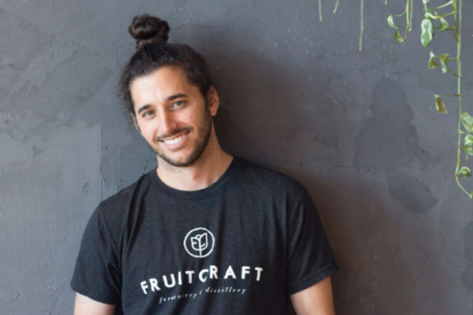 Portrait of Alan Haghighi, CEO and founder of FruitCraft, at the San Diego tasting room.