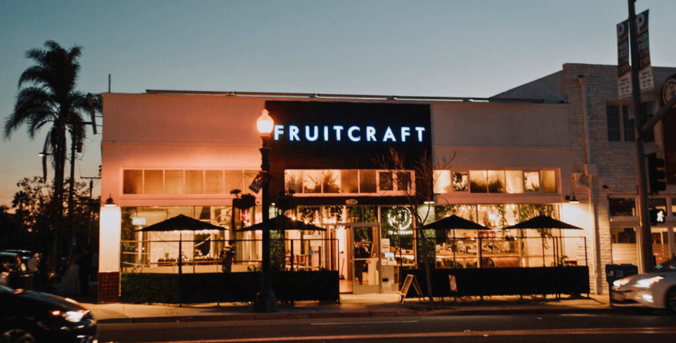 Exterior view of the FruitCraft venue in San Diego, highlighting its rustic-modern charm.